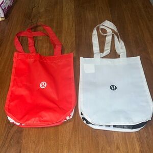 Two Lululemon shopping bags